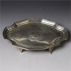 Victorian silver teapot stand, with chippendale style rim and engraved crest to centre, upon four pad feet, hallmarked Thomas Bradbury & Sons, London 1897, W18cm