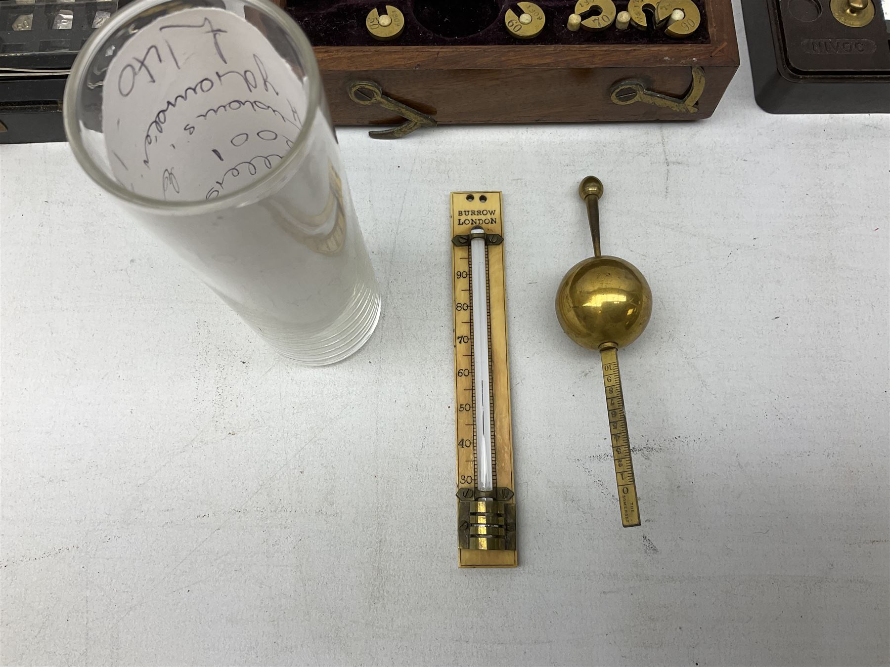 Victorian portable Sikes's hydrometer in original box, the hinged lid with inset plaque for W. & J. Burrow 62 & 63 Great Tower Street London, including ivory backed thermometer, W13.5cm; together with two bakelite cased sets of laboratory scales weights by W.J.George and Becker Ltd. and Philip Harris Ltd. (3)