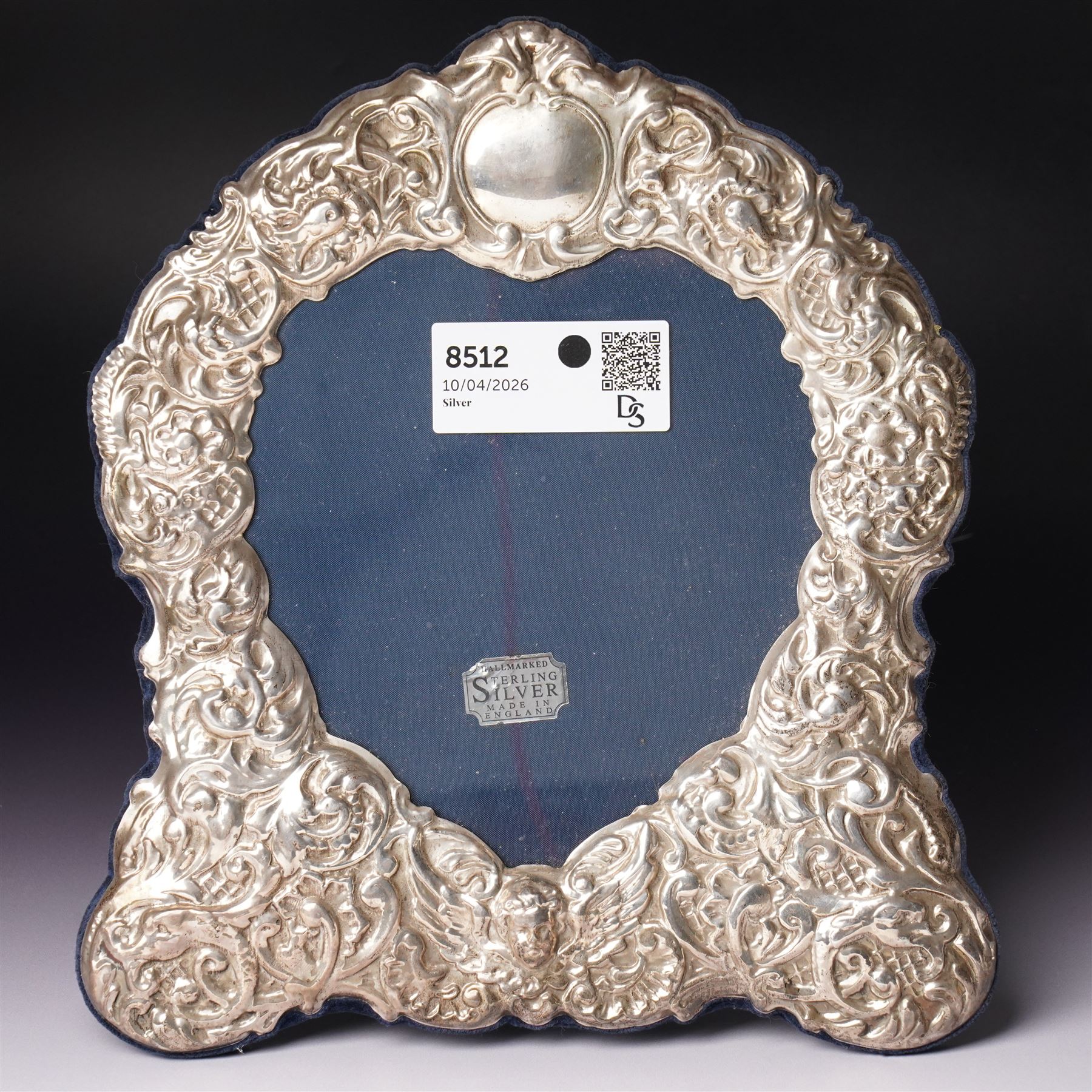 Silver heart shape photograph frame with embossed decoration on easel stand H29cm overall Sheffield 1993 Maker Carr's of Sheffield