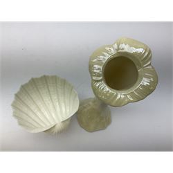 Quantity of Belleek ceramics to include mid-late 19th century jug moulded with green man mask and foliage, date code stamp for 1863-1890, together with later Belleek cornucopia shape vase, jug and other vases together with a Belleek style shell dish raised on branches, tallest H19cm