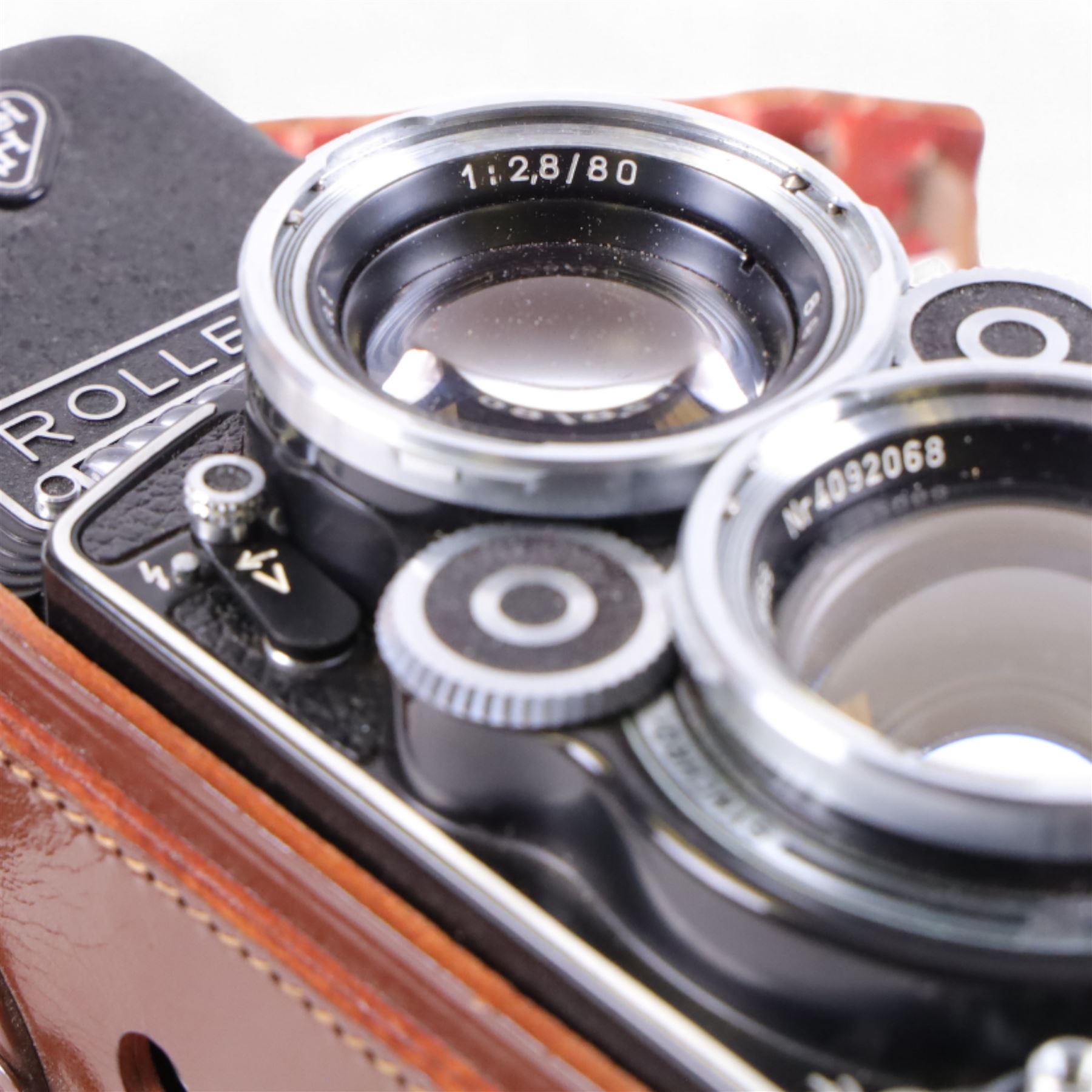 Rolleiflex Franke & Heidecke DBP DBGM 2.8 F TLR camera serial no. 2439093, with a Heidosmat 1:2.8/80 lens serial no. 894062 and a Carl Zeiss Planer 1:2.8 f=80mm lens serial no. 4092068, in leather case with instruction booklet