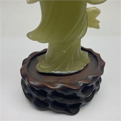 Group of seven Chinese hardstone carvings, to include figure of a standing lady upon a carved wood base, carved duck, figure of a lady under a blossoming tree etc  