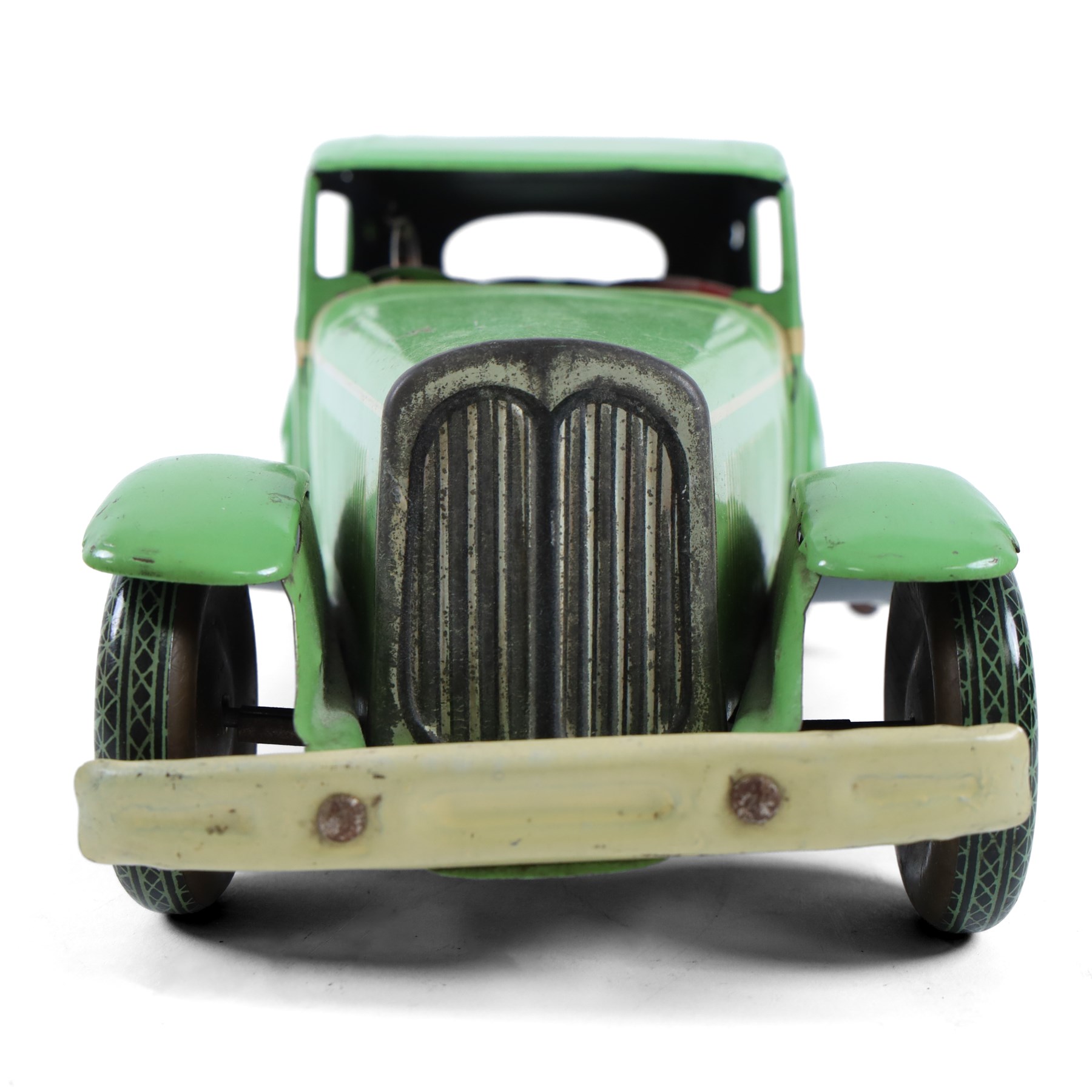 Mettoy large scale tinplate clockwork limousine, circa 1940, with green body and cream lithographed details, red interior with driver, fixed key mechanism, H13cm, L35cm