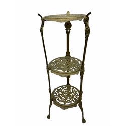Three tiered brass stand with floral and cherub decoration H71.5cm, together with three brass planters, a selection of brass charges, etc.  