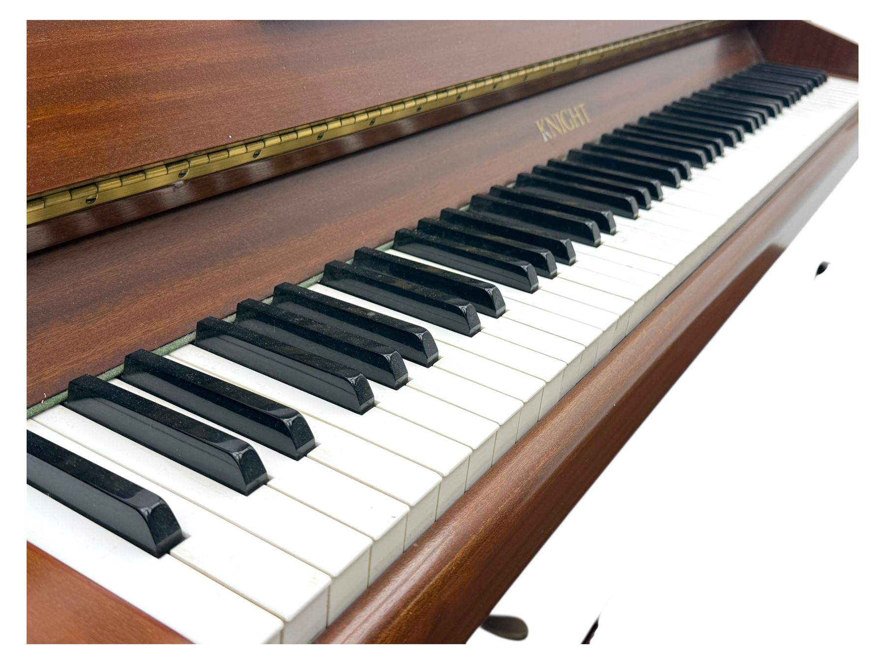 Knight - 20th century upright piano, in polished mahogany case with fall-front lid and twin brass pedals, complete with matching storage bench upholstered in brown fabric with receipt from Harrods (H 50cm x D 37cm W 95cm) 