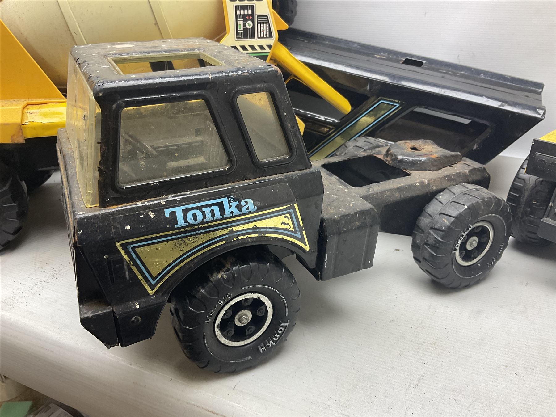 Tonka - five large scale steel pressed vehicles comprising Cement Mixer, Car Transporter, Mobile Crane and two Dumper Trucks (5)