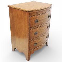Georgian design bow front chest in figured walnut veneers, with moulded top over a pull-ou...