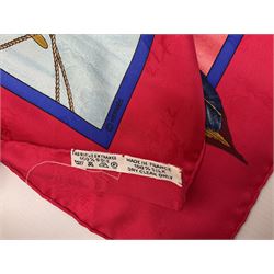 Hermès 'Christophe Colomb Découvre l'Amérique' jacquard silk scarf, designed by Carl de Parcevaux in 1992, limited edition for the bi-centenary of the discovery of America, printed with a central image of Christopher Columbus' ship at sea, surrounded with colourful stylised feathers, birds, flags, globes, shells and flowers, contained within vibrant red border, with rolled hand stitched edges and Hermes material label, 87cm square