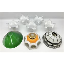 Milk glass lampshade decorated with peacocks, together with a Tiffany style lampshade, a set of five white frilled lamps shades etc 