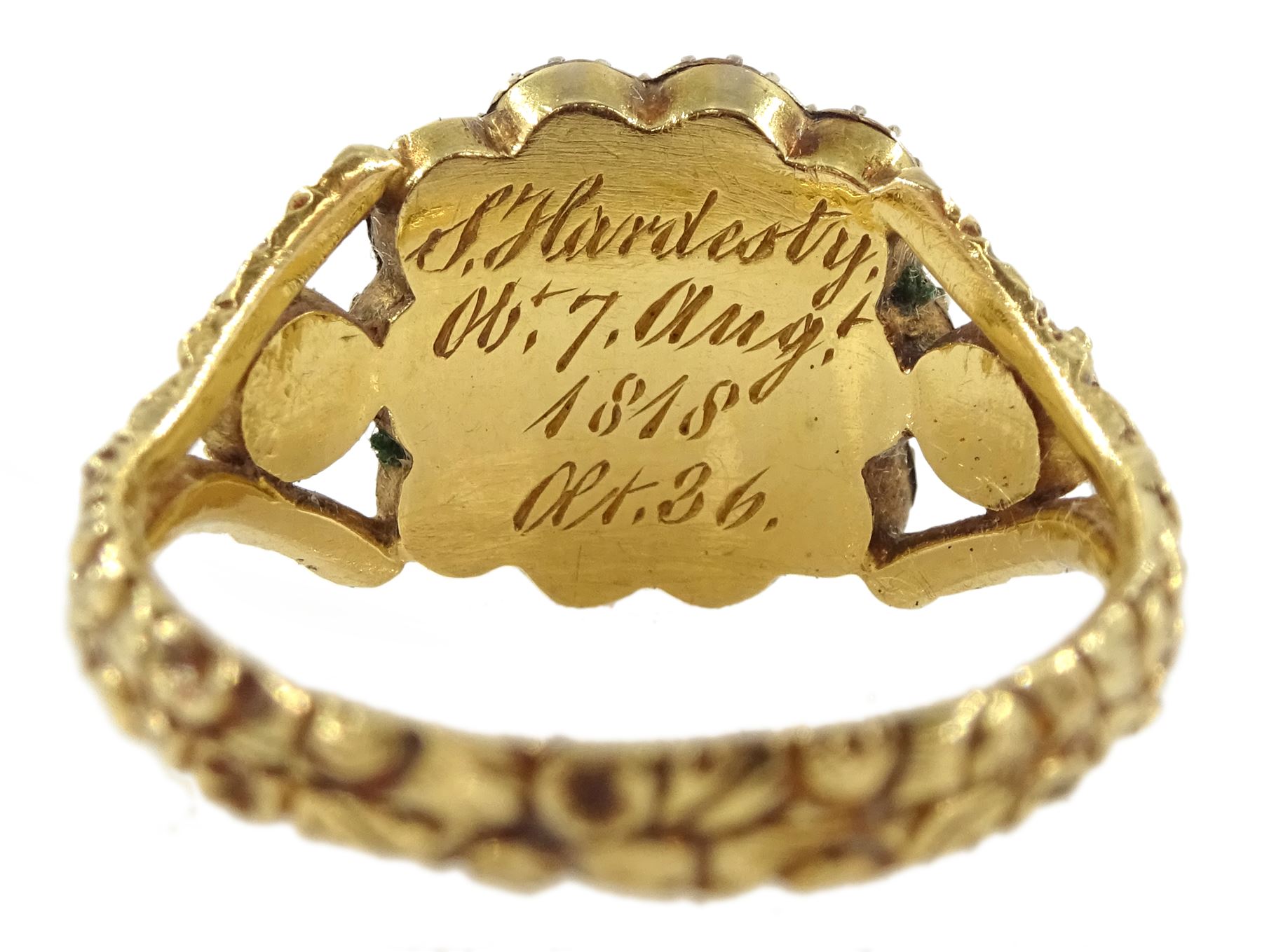 George III gold split pearl mourning ring, with engraved foliate decoration shank, dated 1818