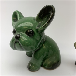 A graduated set of three Denby green glazed dogs, largest marked beneath, largest H15cm. 