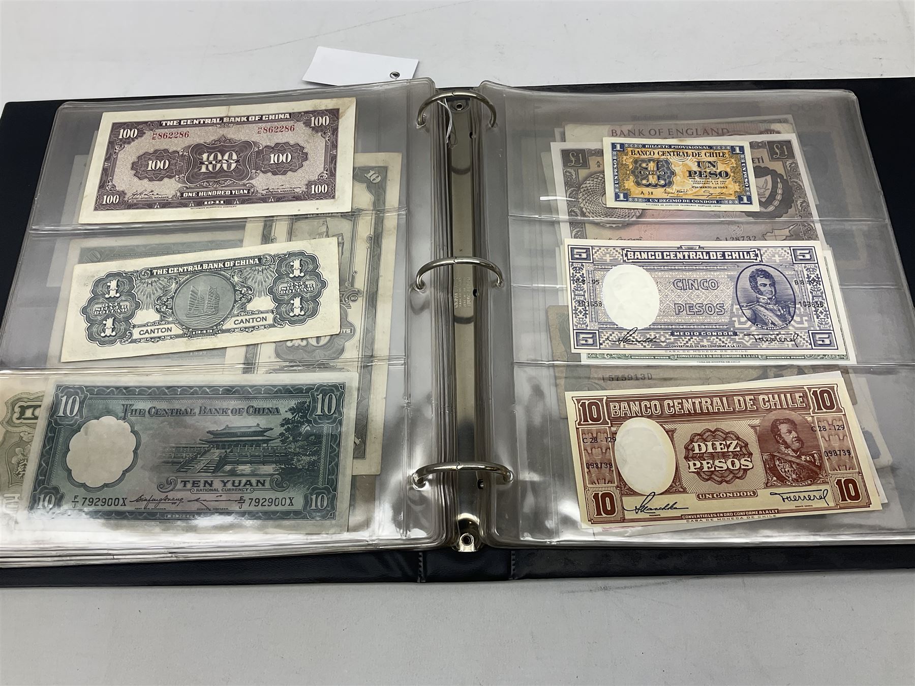 World banknotes, including Queen Elizabeth II The States of Jersey one pound 'DB202703', five pounds 'BB527762' and ten pounds 'AB651481', reserve bank of New Zealand two dollars '1L3 741894', King George V Straits Settlements one dollar 1st January 1935 'F/83 28924', various Bank of England notes etc, housed in two ring binder albums