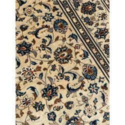Persian Nain ivory ground rug, the field decorated with trailing leafy branches and palmettes, matching border within guard stripes