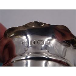 Pair of Victorian silver open salts, of circular form, with girdle and lobed rim, upon three shell mounted pad feet, hallmarked Fenton Brothers Ltd, Birmingham 1900, together with an early 20th century silver mustard pot and cover, of plain circular form, with C scroll handle, shaped rim and engraved initial to body, with knopped finial to slightly domed hinged cover, upon three pad feet, hallmarked Birmingham 1916, maker's mark worn and indistinct, together with a similar silver pepper shaker, hallmarked Birmingham 1911, maker's mark worn and indistinct