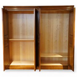 Brigitte Forestier - French cherry wood four door wardrobe unit, fitted with hanging and shelving