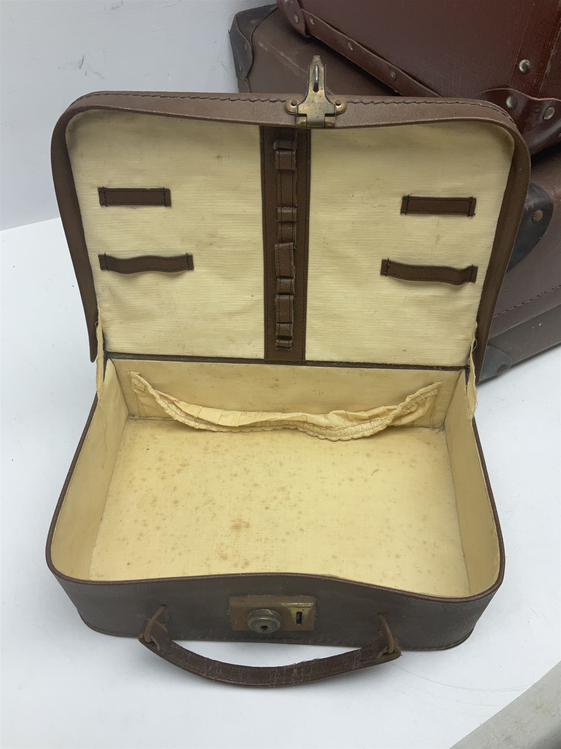 Three shooting sticks, together with four vintage leather brown suitcases of various sizes, largest suitcase H40cm L65cm 