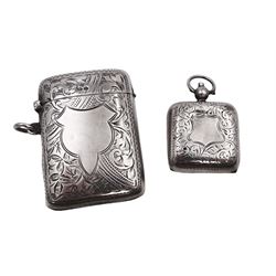 Edwardian silver sovereign case, with engraved foliate and scrolling decoration and blank shield shaped cartouche to centre, hallmarked Martin, Hall & Co, Birmingham 1909, together with an early 20th century silver vesta case, hallmarked Hemming & Walton, Birmingham 1919