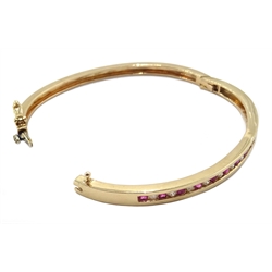  9ct gold channel set ruby and diamond hinged bangle, hallmarked  