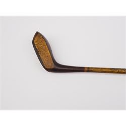 Early 20th century putter, circa 1910, the beech head marked J Winton, with brass sole plate and inset lead weight, the hickory shaft with leather grip, L92cm 