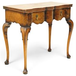 Quality early 20th century Queen Anne design walnut card table, rectangular book-matched veneer fold-over and swivel top with scalloped edge enclosing baize-lined interior, fitted with shaped frieze drawer with brass pear-drop handles over shaped apron, raised on C-scroll carved cabriole supports with pad feet