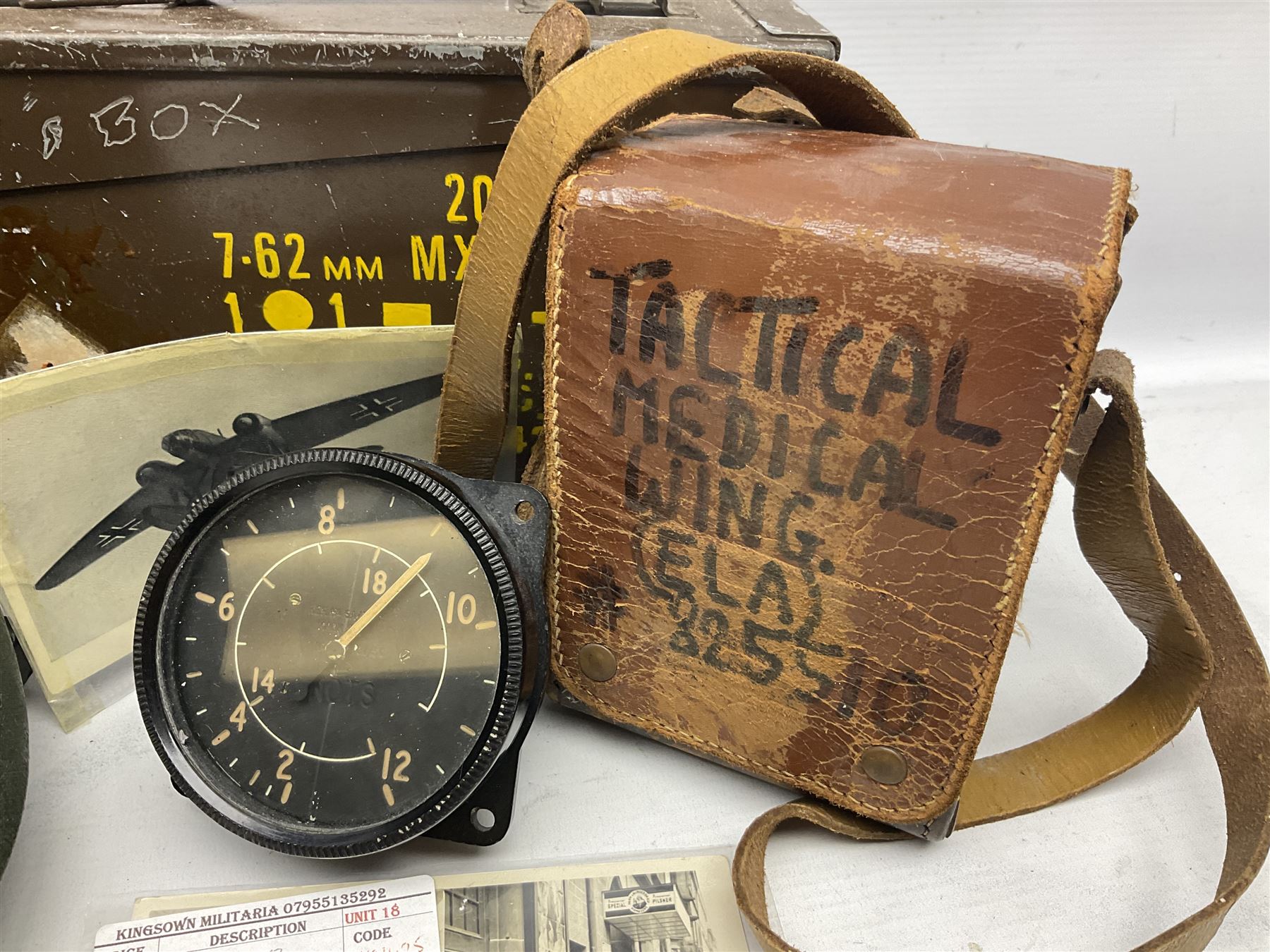 Bakelite cased Megger Insulation tester, by Evershed and Vignoles Ltd, Acton Lane Works, Chiswick, London W4, RW Munro Ltd air speed knots gauge, American green army helmet, The War Illustrated, WW2 aircraft photographic postcards, etc