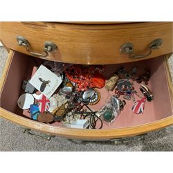 Large quantity of costume jewellery, including clip on earrings, stud earrings, rings, cufflinks and some silver Baltic amber jewellery etc, all housed within large jewellery box, with six small drawers above three larger drawers, upon four legs, and two hanging plastic jewellery holders, 