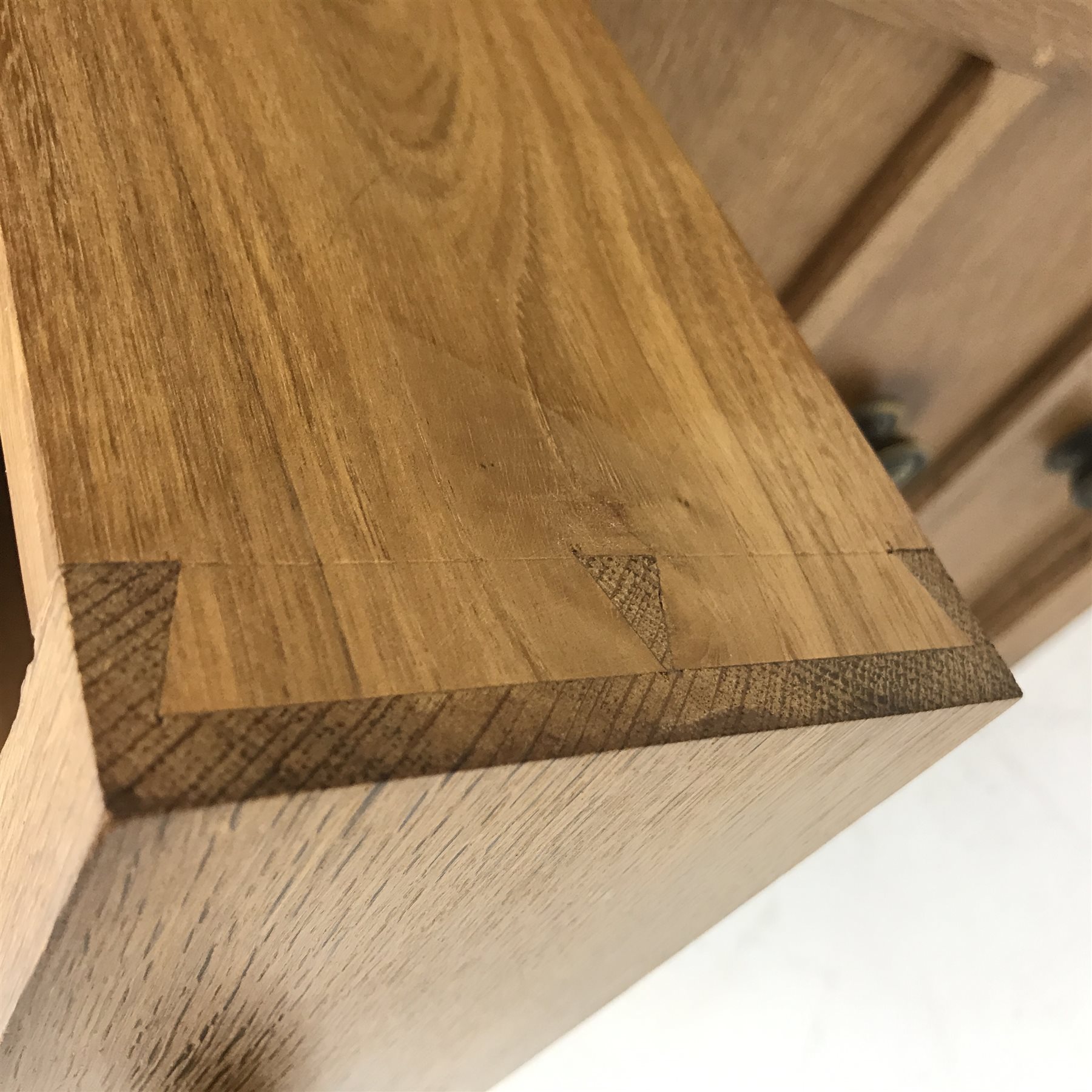 'Lizardman' oak kneehole desk fitted with six drawers and two glazed bookcases, by Derek Slater of Crayke, W347cm, H72cm, D61cm