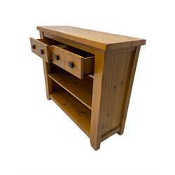 Rustic pine dresser, fitted with two drawers over two open shelves