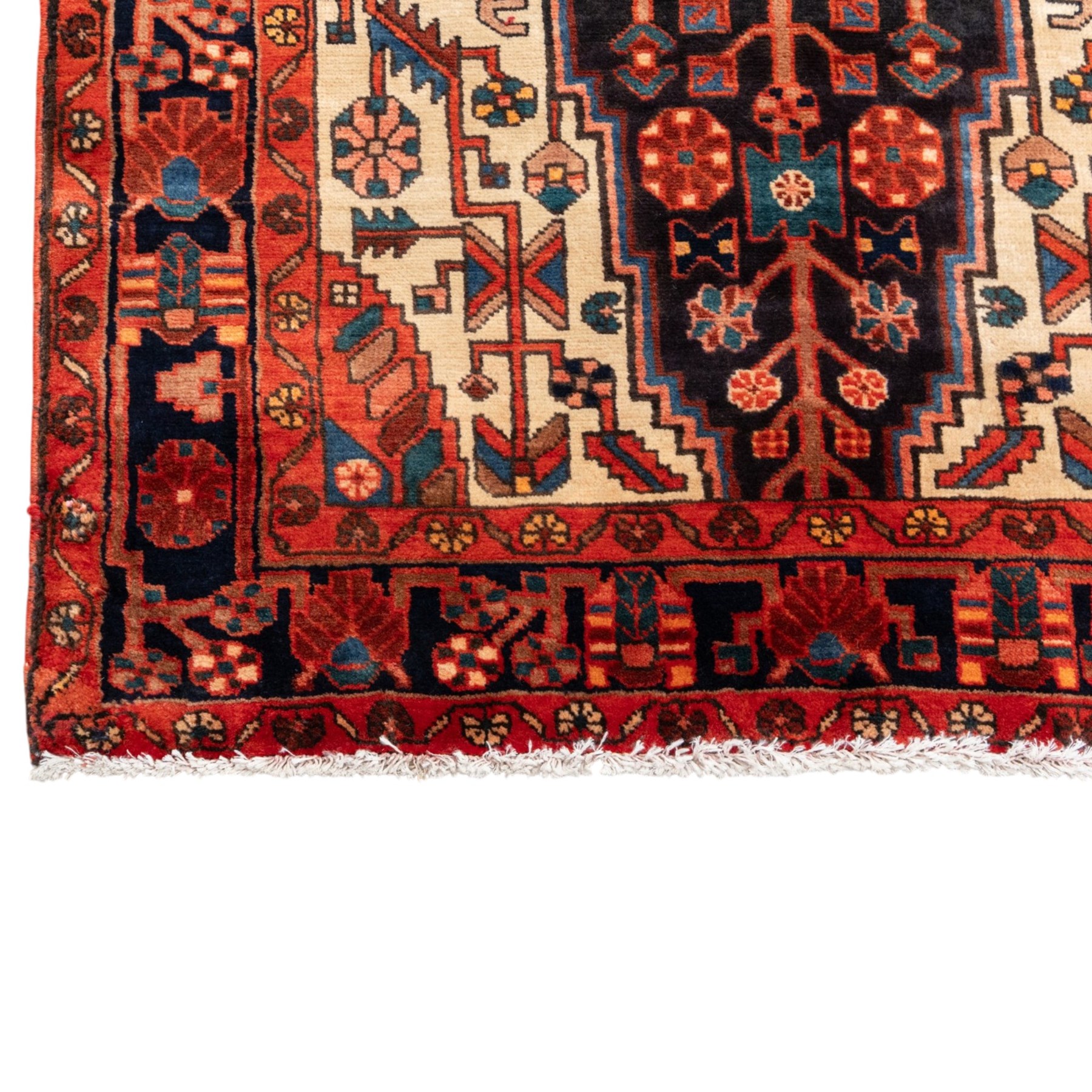 North West Persian runner, the indigo field centred by a red elongated hexagonal medallion with pendant motifs, surrounded by angular flowering stems, ivory stepped floral spandrels, enclosed by an indigo palmette border and red floral guard bands