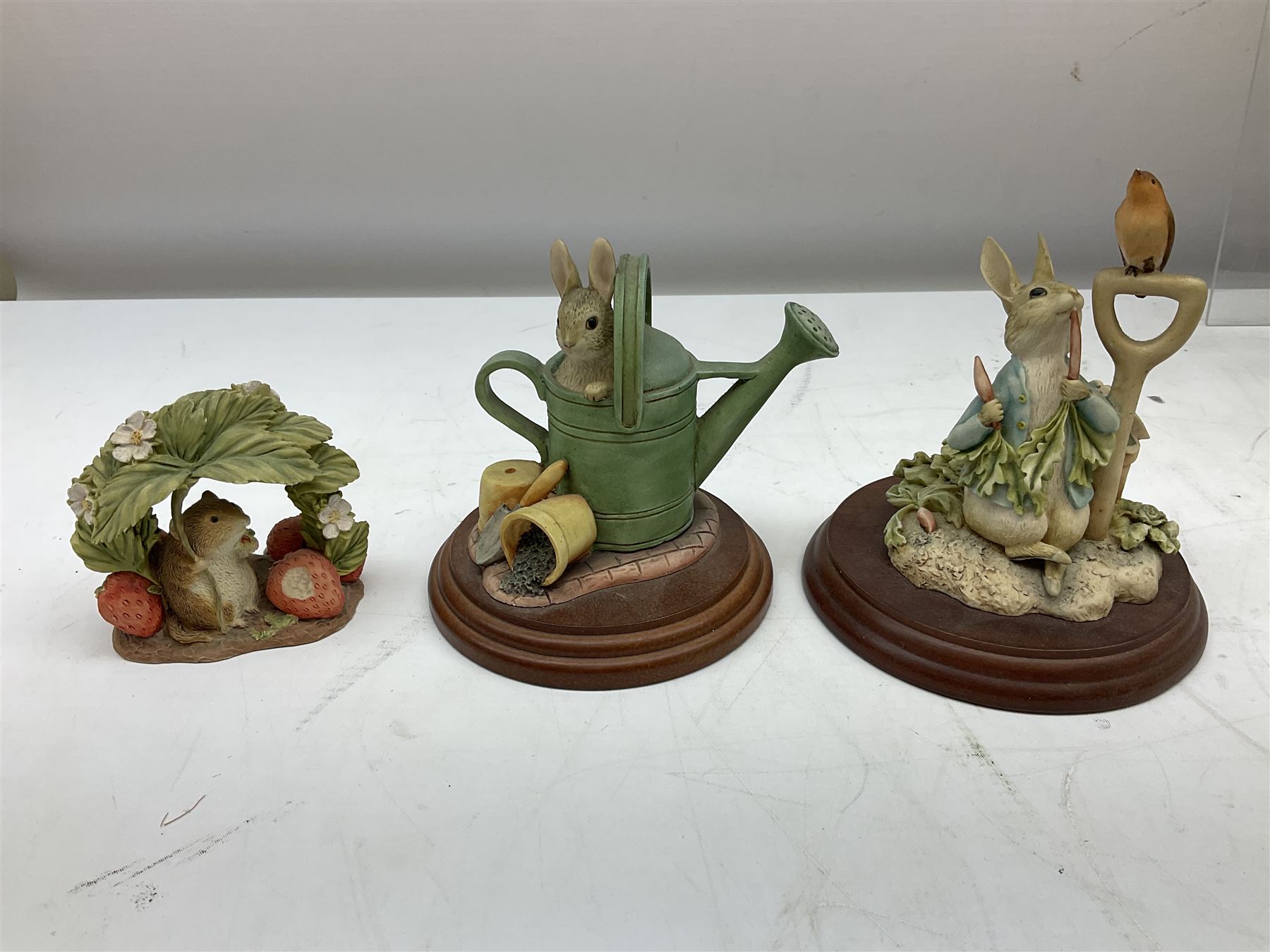 Frederick Warne & Co The World of Beatrix Potter figures to include Peter Rabbit in Mr Mcgregor's Garden, Peters Hiding place, Mrs Tiggy Winks, The Tale of Jonny Town-Mouse, etc, many with original boxes 