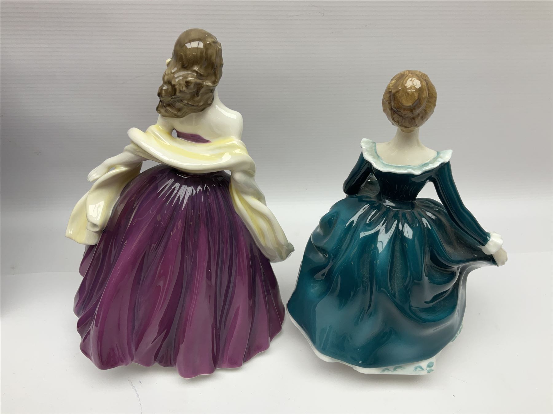 Eight Royal Doulton figures, comprising Rachel HN2936, The Skater HN3439, Janine HN2461, Innocence HN2842, Special Celebration HN4234, Autumn HN4272, Fiona HN2694 and Winsome HN2220, together with three smaller Royal Doulton figures My First Figurine HN3424, Buttercup HN3268 and Autumn Breezes HN2176