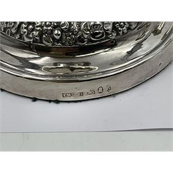 Four George III silver candlesticks, each upon knopped stem and weighted circular stepped foot, the foot and removable sconce repousse decorated with a band of flower heads, hallmarked to sconce and foot Thomas & John Settle, Sheffield 1820, H17.5cm