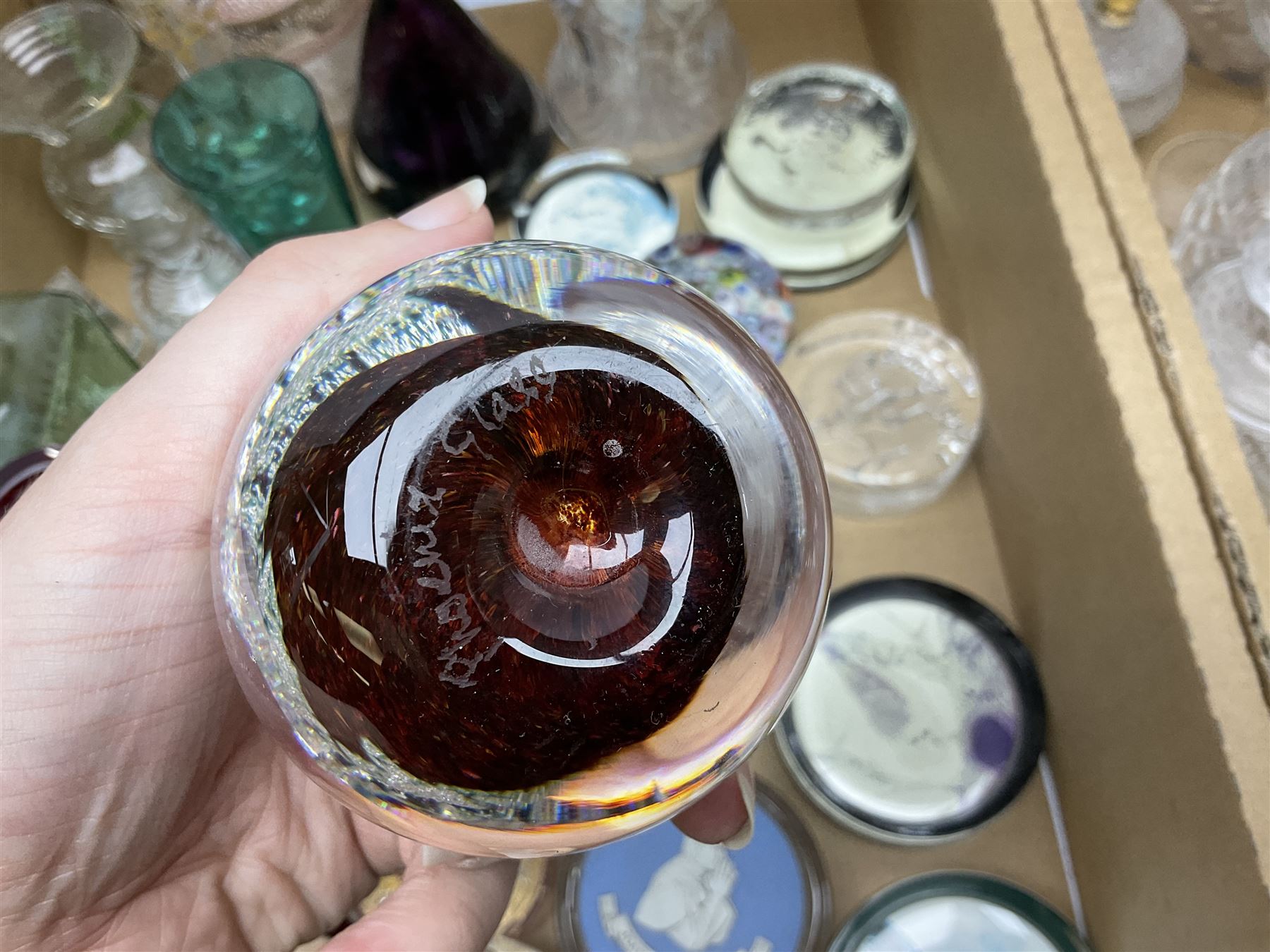 Millefiori paperweight, together with Caithness paperweight, Isle of Wight vase, cranberry glass tumblers, claret jug, decanters and other glassware, in three boxes 