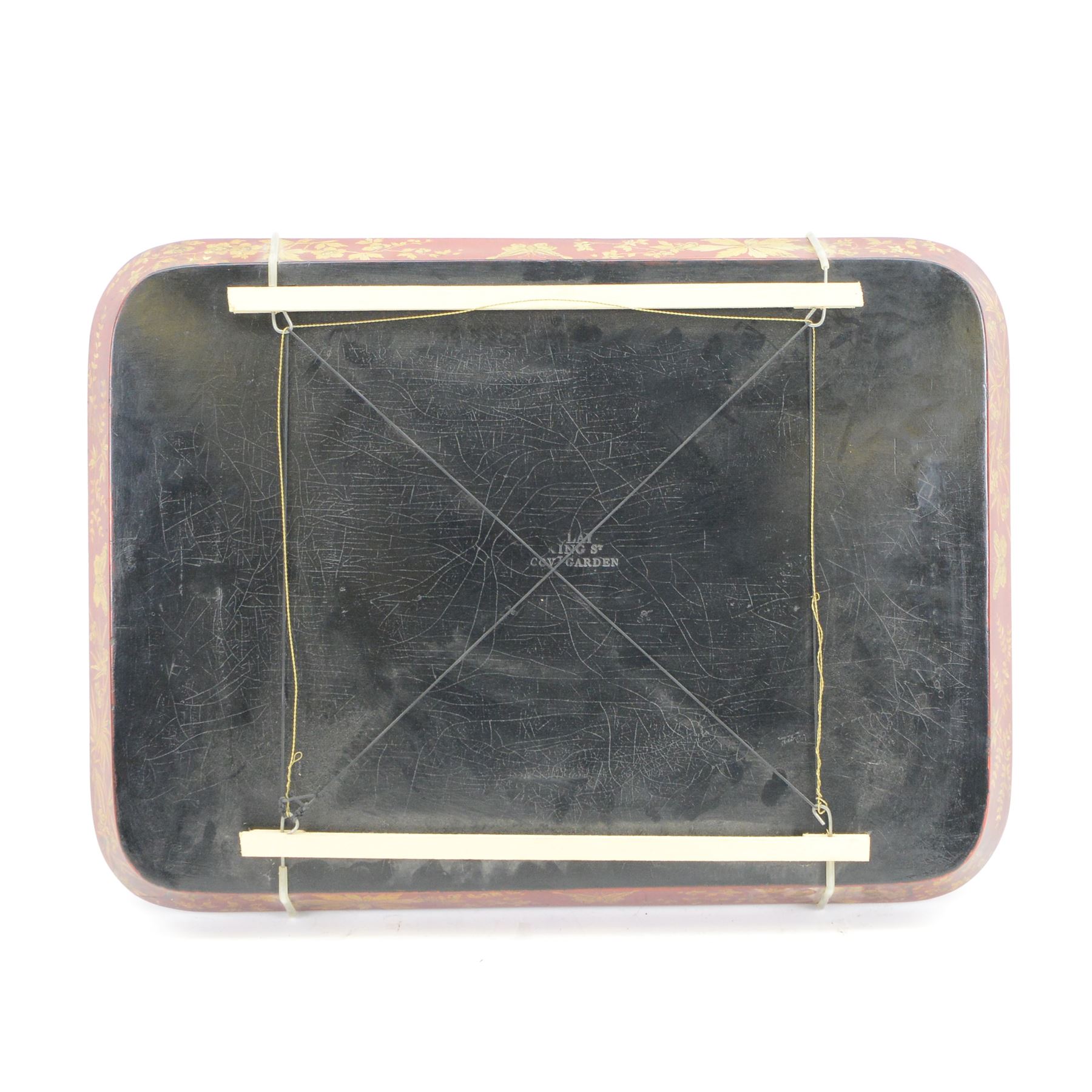 Early 19th century red lacquered papier-mâché tray by Clay of King Street Covent Garden, of rounded rectangular form, painted in gilt with large foliate sprays and butterflies, impressed verso CLAY KING ST COVENT GARDEN, W66.5cm D48.5cm