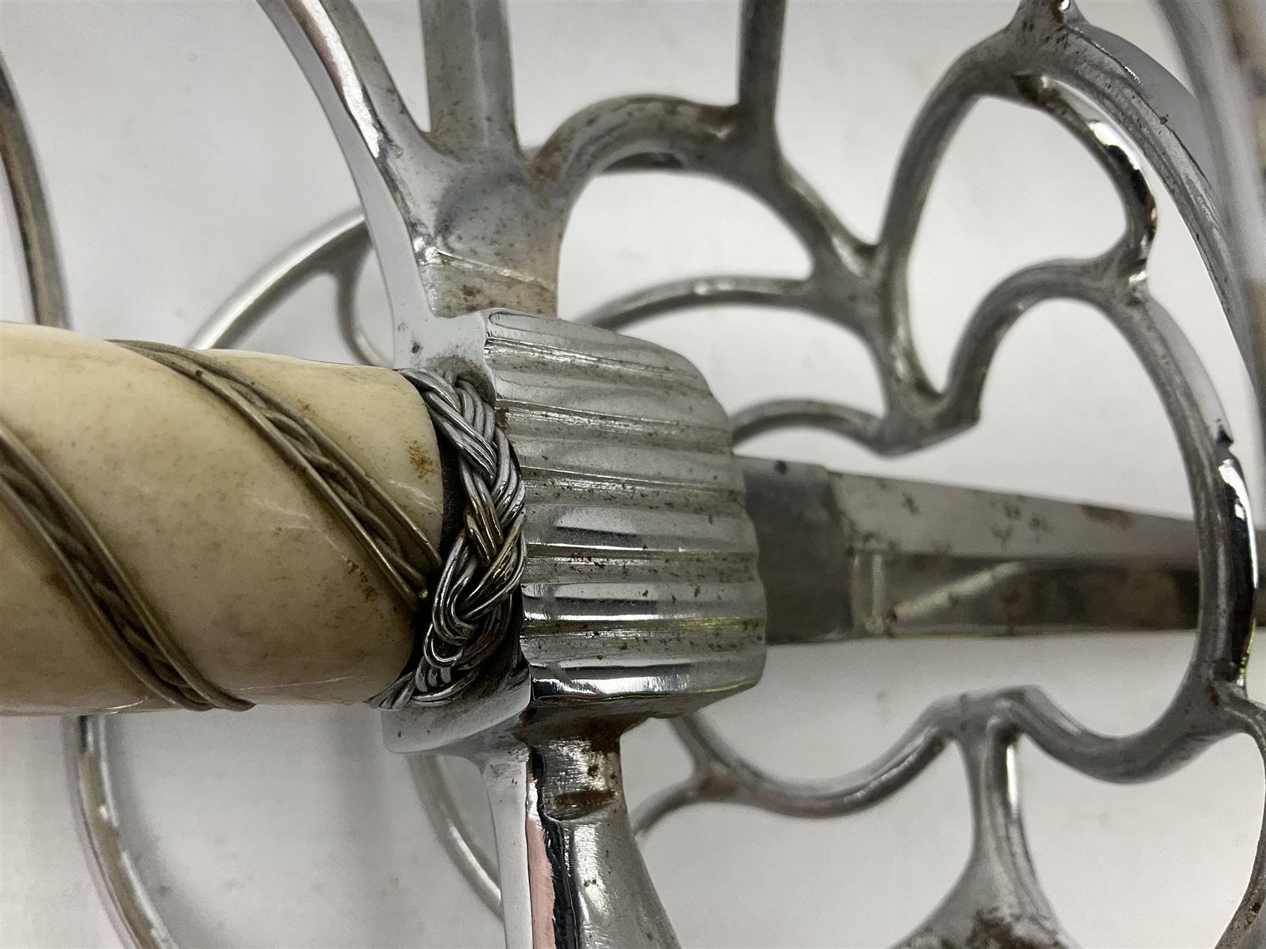 Replica knight's longsword, the 91.5cm double-edged steel blade with basket hilt and wire-bound bone grip with spherical pommel, in leather scabbard L112cm overall