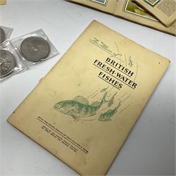 Quantity of Kensitas silk cigarette cards depicting world flags, together with albums of fish cigarette cards and quantity of crowns to include boxed examples