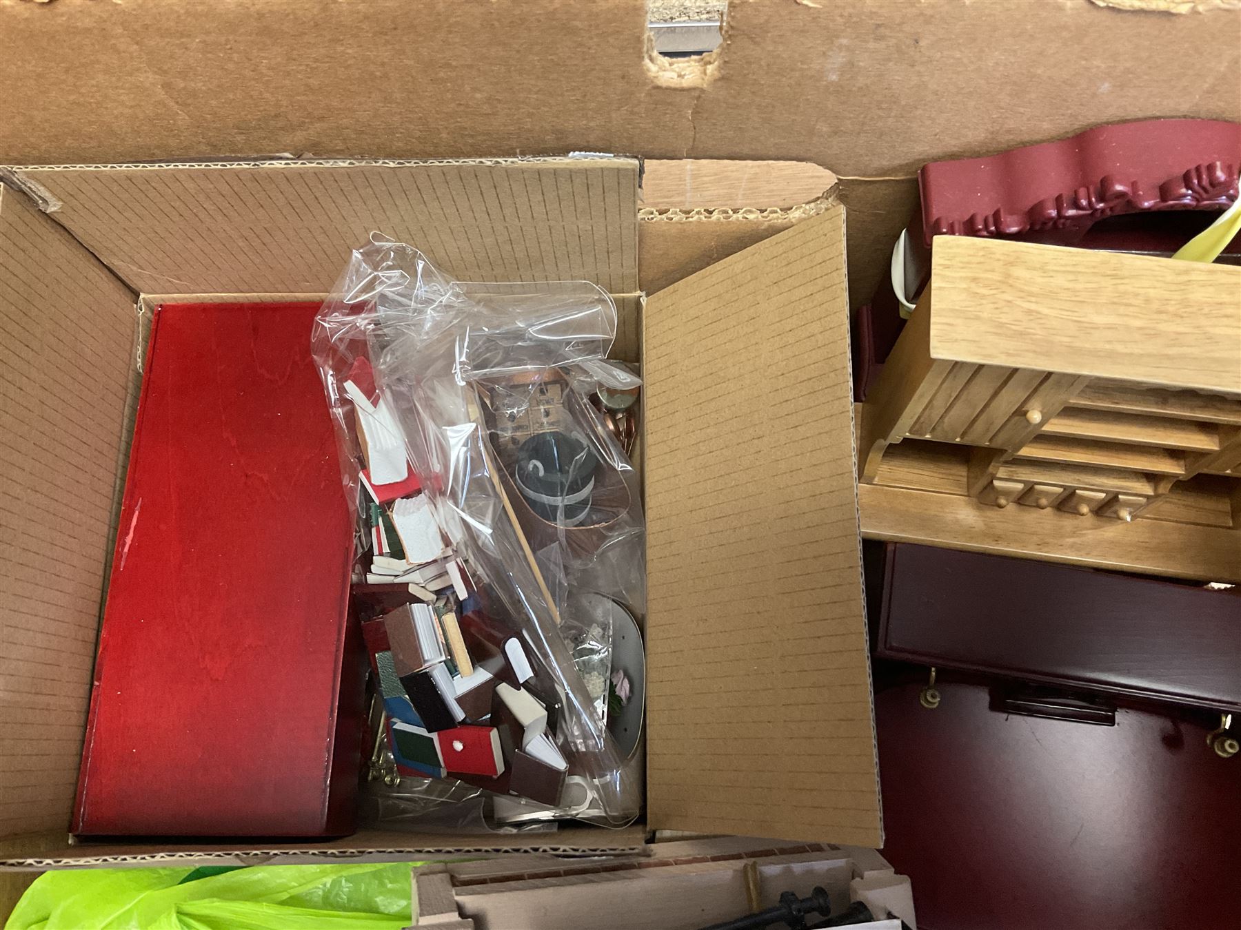 'The Hollies' - good quality sectional wooden doll's house in the form of a Georgian style four-storey bay windowed town house with simulated brick front elevation, rendered sides, off-set corner stonework, faux slate-hung top floor with flat roof and chimney stack, working sash windows, iron railings around front basement courtyard with hinged front elevation to two rooms with  spiral staircase, side hinged central section approached by external steps with iron balustrades to the sides leading to a front door, entrance hall with stairs to landing and two rooms on two floors with dado panelling and fire-surrounds, the top floor with top hung front elevation revealing stairs to a landing and bedroom; wired for electricity L51cm D65cm H107cm including chimney; together with a good quantity of quality wooden furniture and accessories including piano, dressers, bookcase and books, rugs, double half-tester bed, metalware, pictures etc