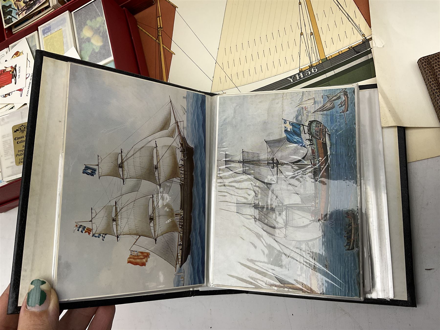 Set of four framed coloured prints humorous fire brigade related, after Chris Reynolds, together with Brooke bond picture cards, to include Asian wild life, the race into space, travel through the ages etc