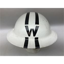 WW2 Home Front 'Police' black painted steel helmet with original liner and webbing chin strap, impressed R.O. Co. 1/1939; and re-painted shell only for WW2 Wardens steel helmet impressed AMC II 1941 C676 (2)