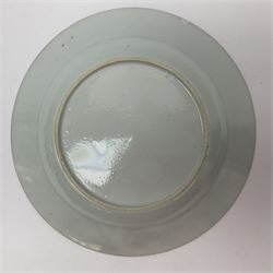 Three 18th century Chinese Famille Rose plates, the first example enamelled with blossoming peonies, rockwork and fence, the other two examples of similar design, decorated with blossoming peonies and sprigs within shaped inner borders, each approximately D23cm