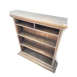 Early 20th century oak open bookcase, dentil cornice and base
