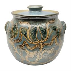 John Egerton (c1945-): studio pottery stoneware large twin handled pot, decorated with flowering sprigs on a blue ground, H33cm
