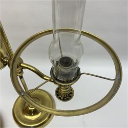 Brass adjustable student's oil lamp, with yellow glass shade, H52cm