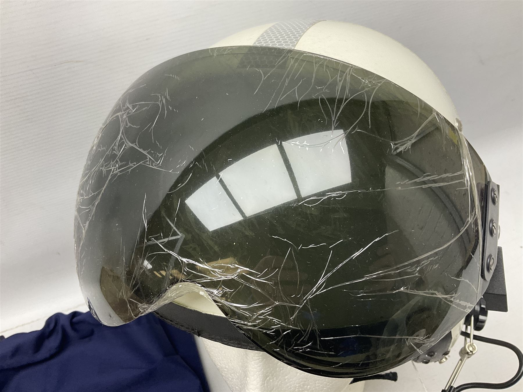 RAF Alpha MK 4 helicopter pilot's flying helmet, finished in white for civilian/rescue service use; reconditioned and avionics tested as working; black cloth cover to visor; fitted with boom microphone; medium size; in blue cloth carrying bag
