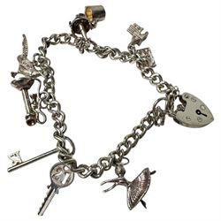 Three 9ct gold brooches, including two stone set examples, silver charm bracelet, amber type beads and gilt metal jewellery
