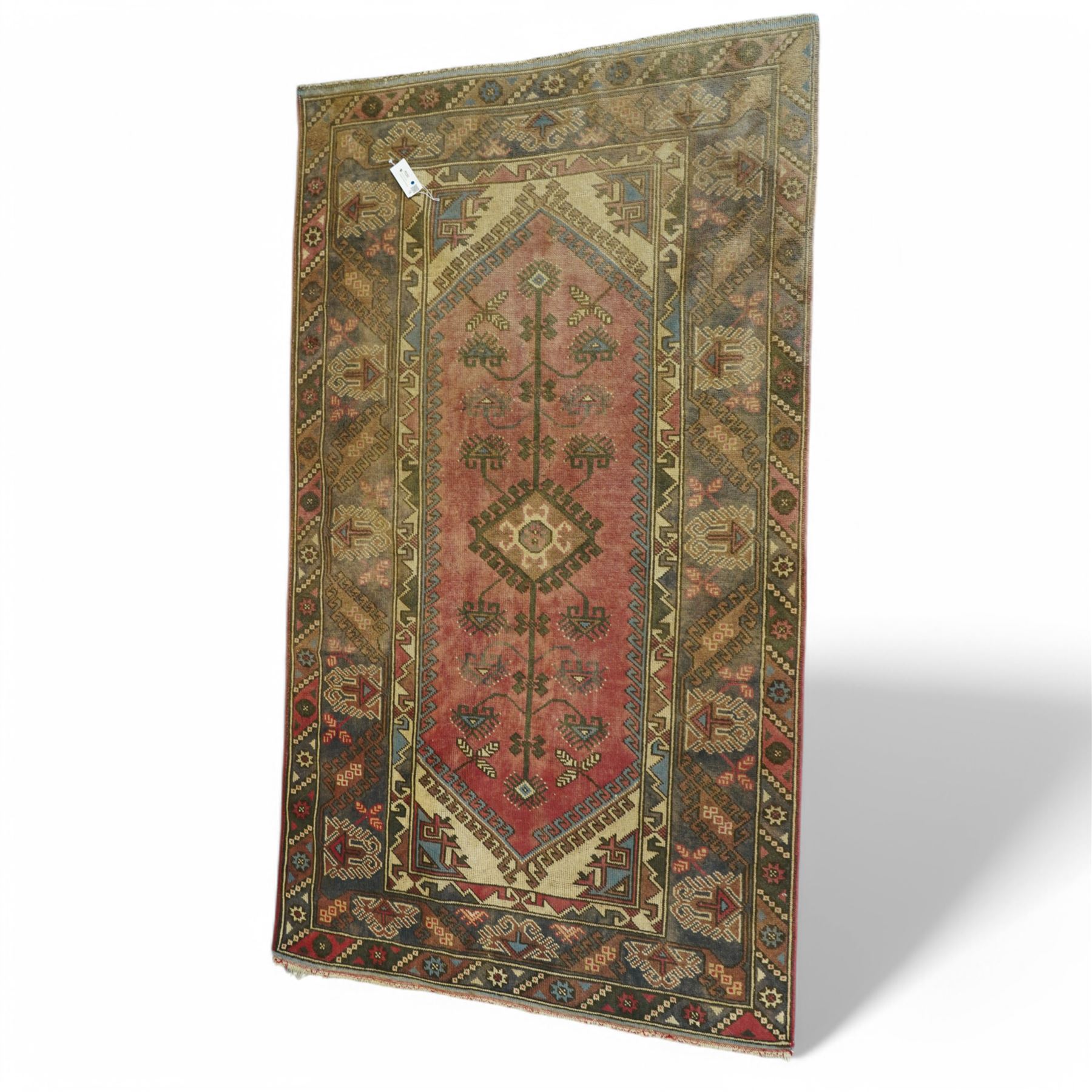 Persian crimson ground rug, decorated with small geometric motifs and animals (158cm x 83cm); together with a Turkish rug (206cm x 119cm)
