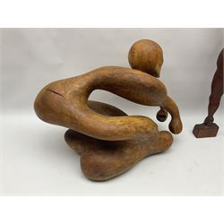 Helen Skelton (British 1933 – 2023): Three carved wooden abstract sculptures, each modelled as a a figure, tallest H52cm. Born into an RAF family in 1933 in Kent and travelled the world extensively during her childhood. After settling in Bridlington, Helen immersed herself in painting, textiles, and wood sculpture, often inspired by nature's beauty. Her talent was showcased in a one-woman show at Sewerby Hall and recognised with the sculpture prize at Ferens Art Gallery in 2000. Sadly, Helen’s daughter passed away from cancer in 2005. This loss inspired Helen to donate her sculptures to Marie Curie upon her passing in 2023.