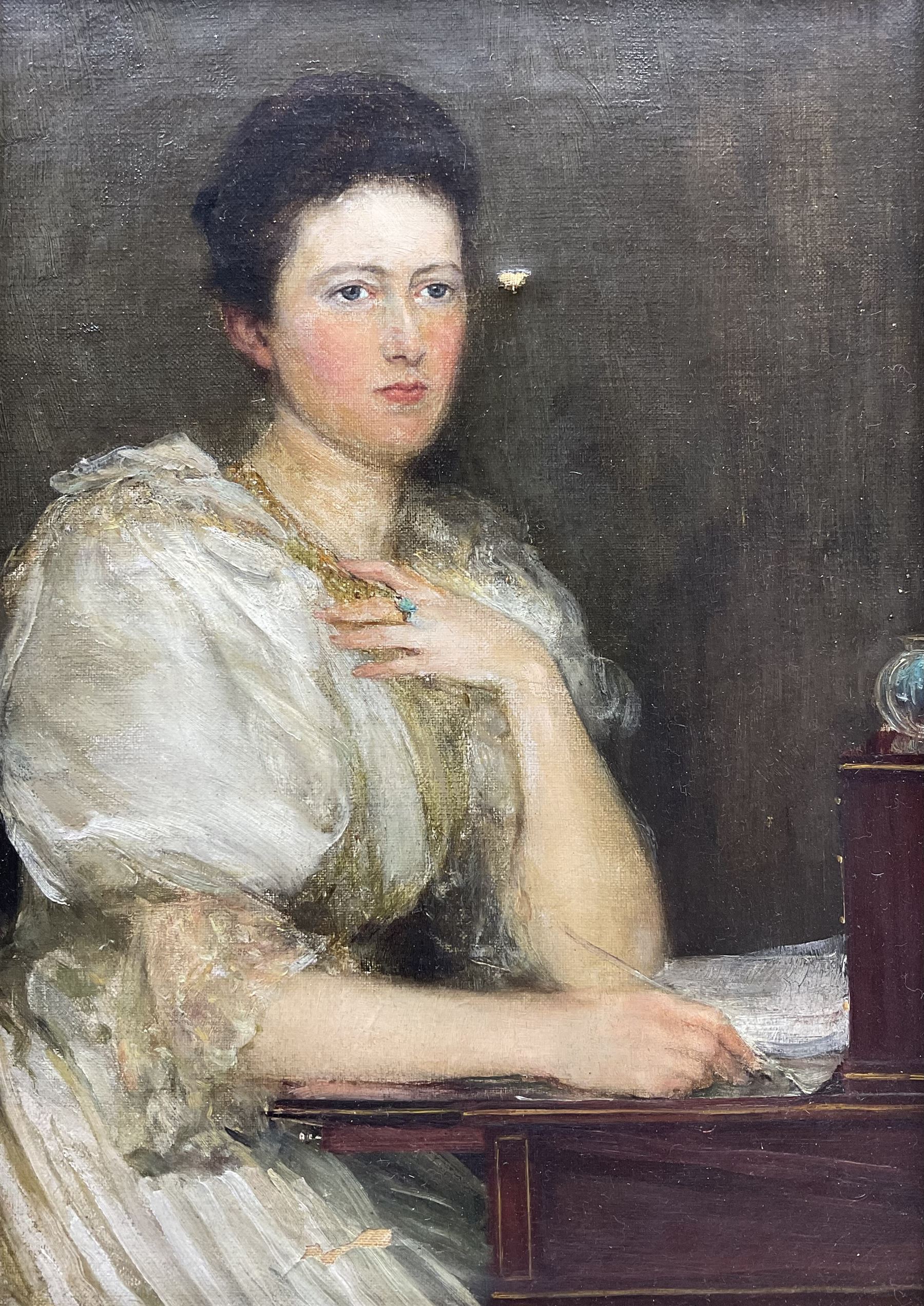 Theodore Blake Wirgman (British 1848-1925): Portrait of a Lady in her Study, oil on canvas signed 35cm x 24cm 