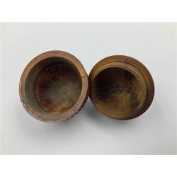 Three 19th century coquilla nut pomanders or flea catchers, two of egg shaped form and the third of barrel from with carved and pierced decoration and screw threaded join, largest H8cm