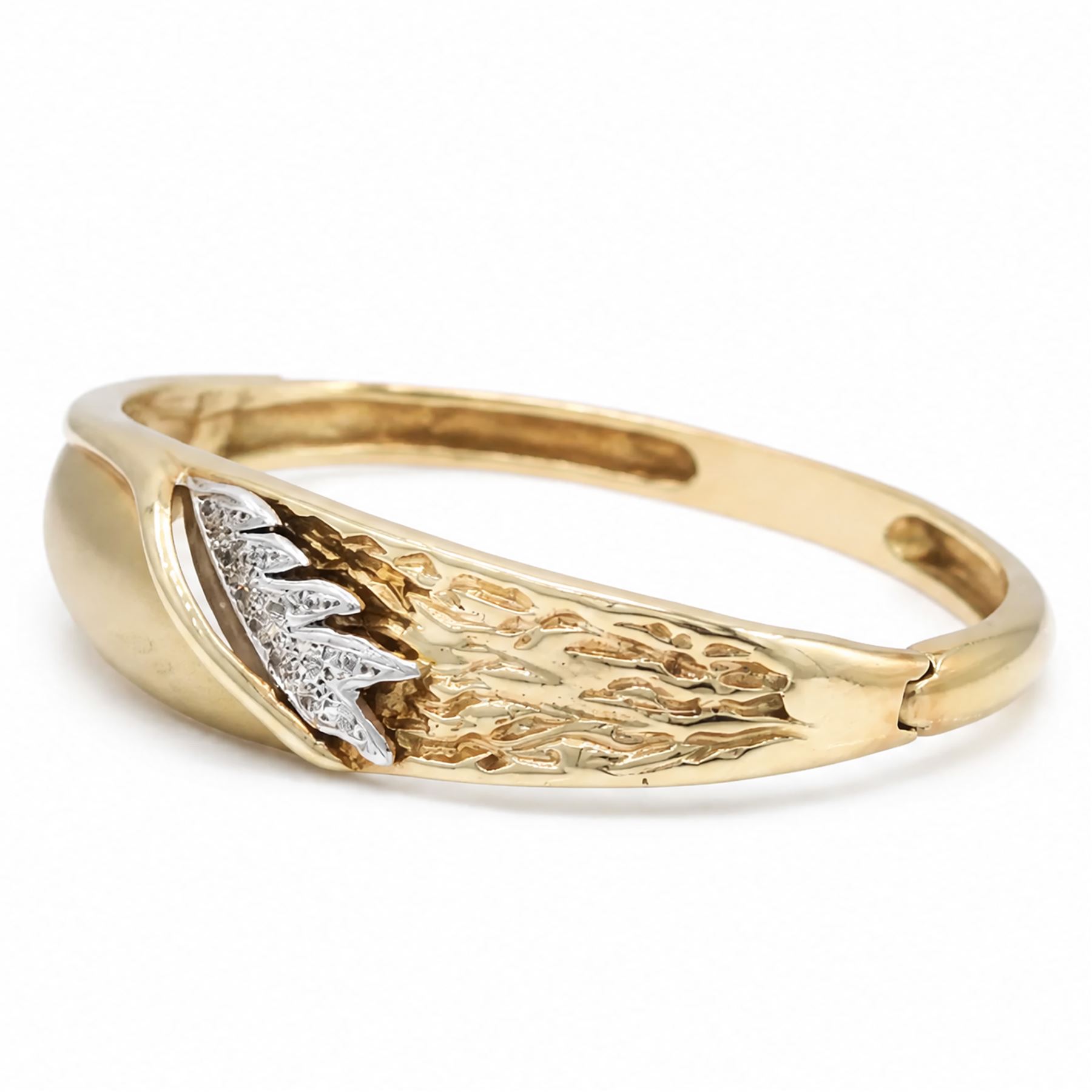 14ct yellow and white gold cubic zirconia abstract design hinged bangle, stamped 585